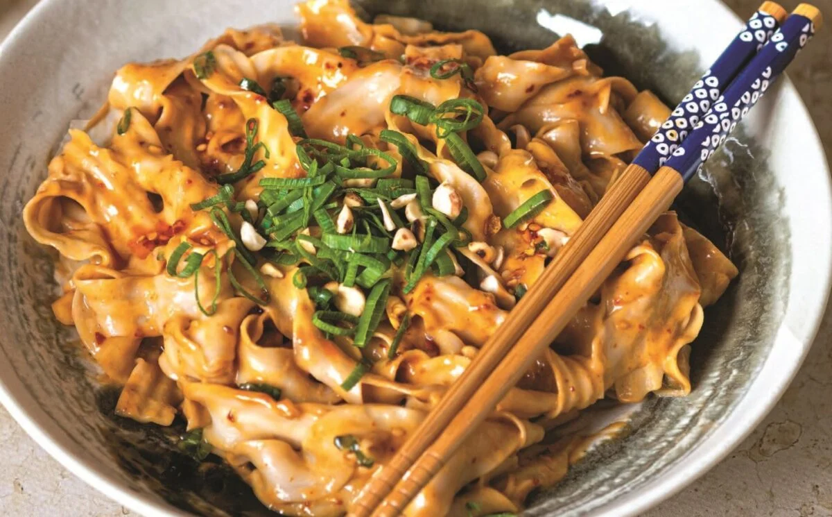 A bowl of creamy vegan peanut butter noodles