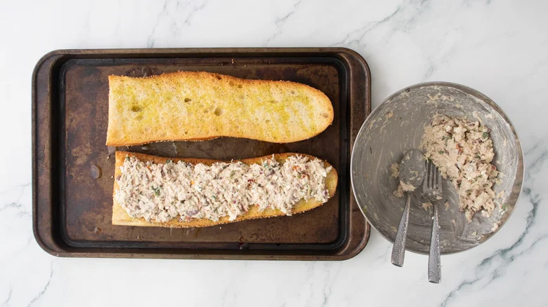 Tuna salad on a large toasted baguette.