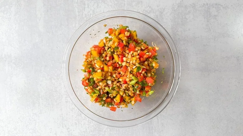 Mango-corn salsa in glass bowl