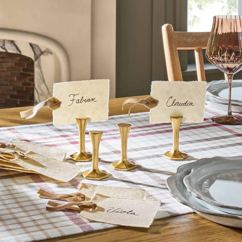 Gold place card holders on table 